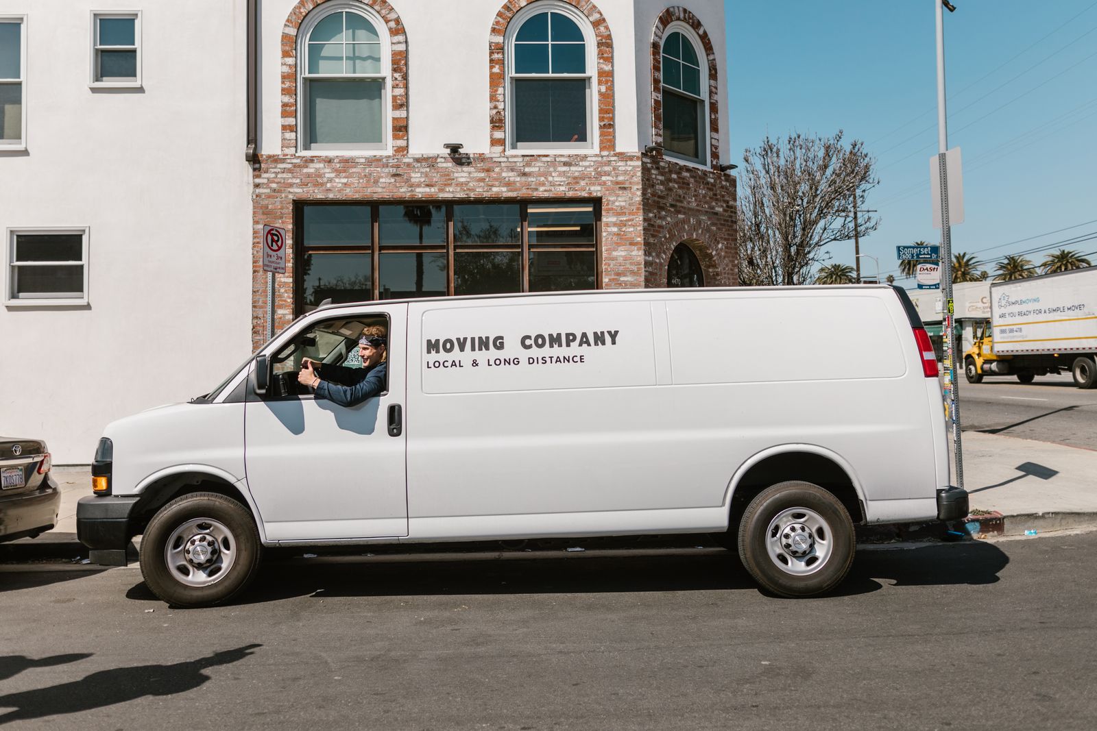 White moving van on a sunny street